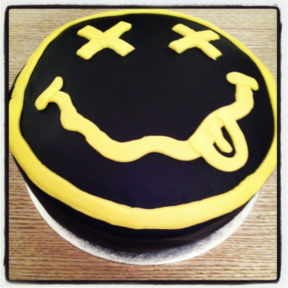 Black and yellow Nirvana smiley face cake